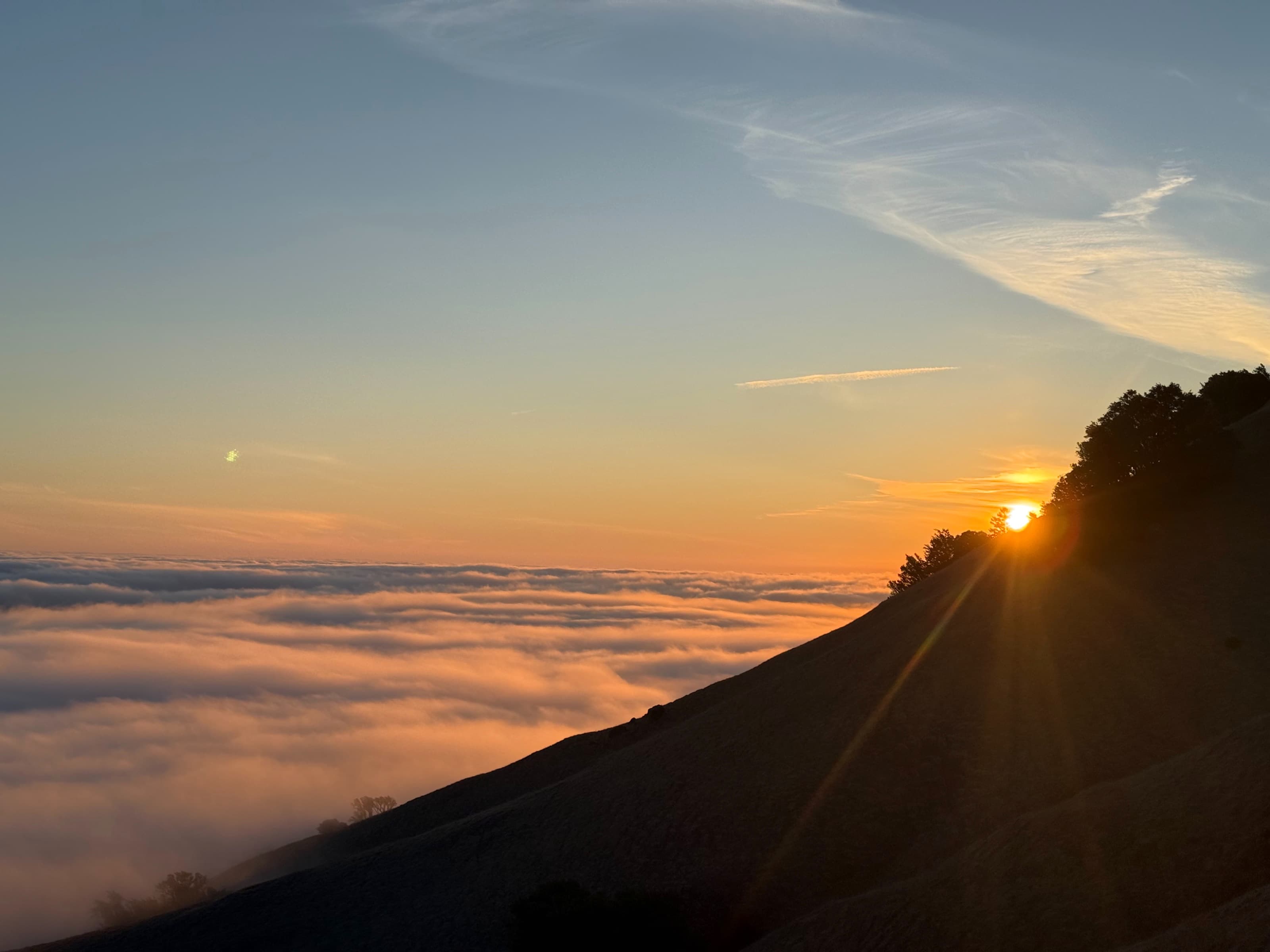 The sun setting over the marine layer at Trojan Point.
