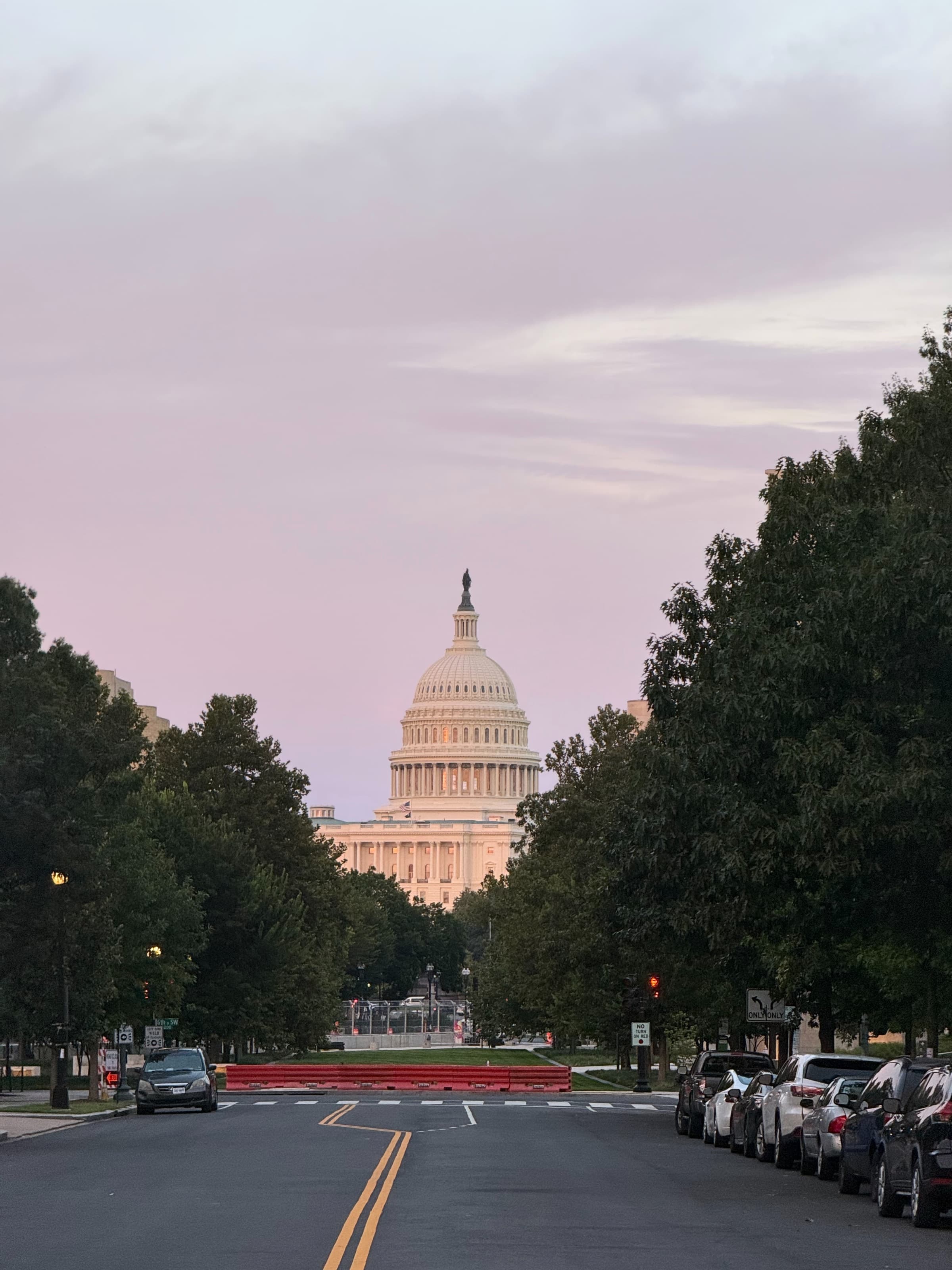 The US Capitol at dusk, viewed along Maryland Avenue SW from 7th Street.