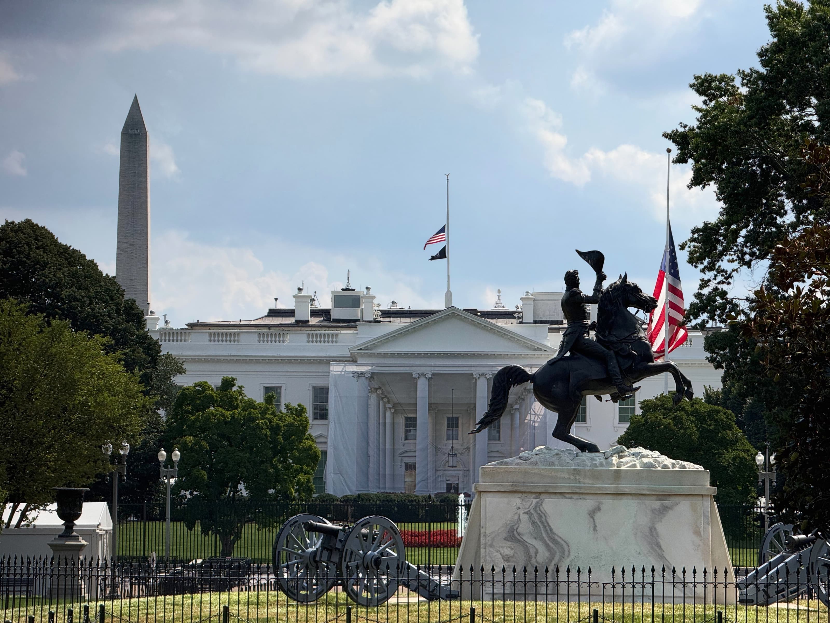 The White House behind the Andrew Jackson statue in Lafayette Square, with the Washington Monument at left.